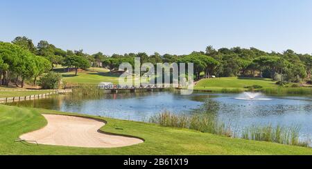 Sports golf park in Portugal. Near lake and fountain. Stock Photo