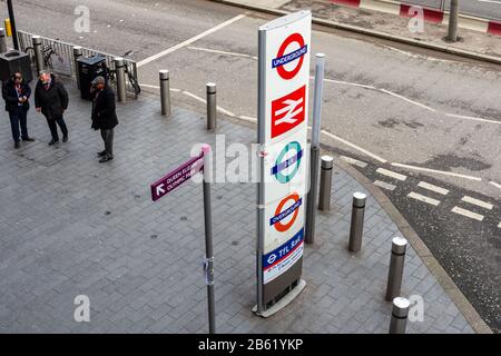 London, England, UK - January 17, 2020: A totem sign on a street outside Stratford Station avertises the Transport for London and National Rail transi Stock Photo