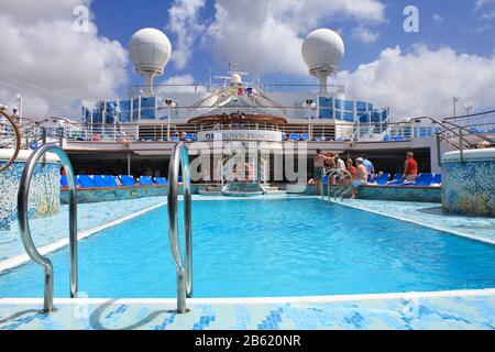 WILLEMSTAD, CURACAO - FEBRUARY 11, 2014 : View on top deck with swimming pool on Crown Princess ship. Crown Princess is a Grand-class cruise ship owne Stock Photo