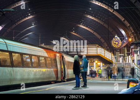 York, England, UK - January 29, 2017: Passengers at York railway station await the departure of a Virgin Trains East Coast intercity train. Stock Photo