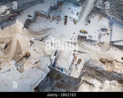 High stone mountain and marble quarries in the Apennines in Tuscany,  Carrara Italy. Open marble mining. Stock Photo