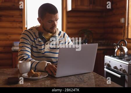 Caucasian man working on his laptop Stock Photo