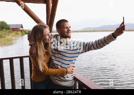 Caucasian couple taking a selfie Stock Photo