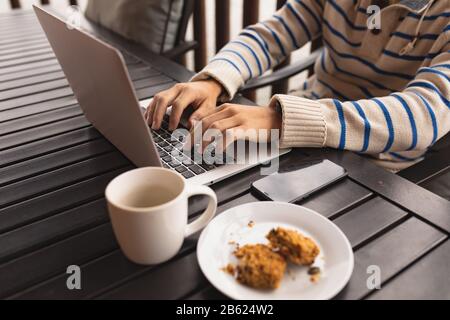 Caucasian man working on his laptop Stock Photo