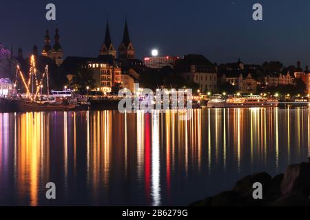 Koblenz, Germany lit up across the Rhine river at night during an annual event. Stock Photo