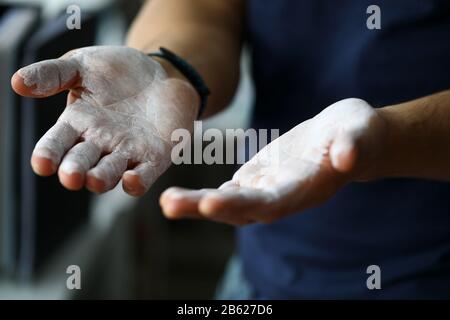 Male hands smeared with magnesium powder ready to workout Stock Photo