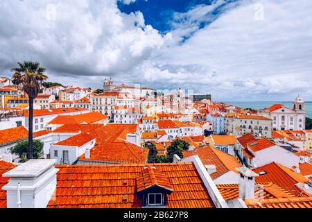 Lisbon, Portugal city skyline over the Alfama district. Summertime sunshine day cityscape in the Alfama, historic old district Alfama in Lisbon, Portu Stock Photo