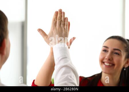 Happy workers in office celebrating new corporate achievement Stock Photo