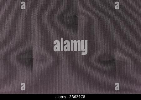 A fragment of the upholstery of the sofa of grey color close up Stock Photo