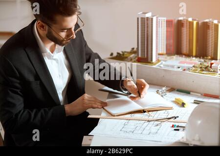 young designer concentrated on his work, creativity, development of new neighbourhood. close up side view photo Stock Photo