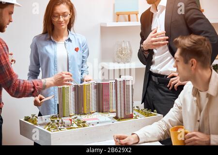cheerful young team discussing the rennovation of the district. close up photo. job, profession Stock Photo