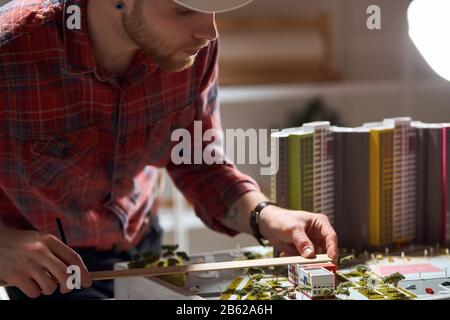 young professional builder making model house.. close up cropped photo.architectural, construction and engineering industry Stock Photo