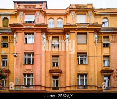 Budapest, Hungary, Aug 2019, view of the top part of a bicoloured building Stock Photo
