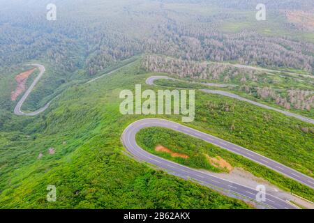 Japan, Honshu, Yamagata prefecture, aerial view of mountain road on Mt. Zao san Stock Photo