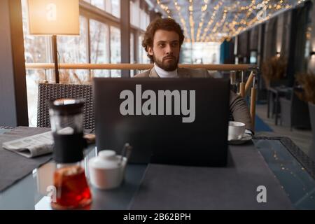 puzzled serious guy in fashion casual clothes having bad mood, thinking about business. close up photo. failure, unsuccessful bussiness, deal Stock Photo