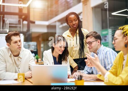 young stylish people sharing with knowledge , information at the meeting. close up photo Stock Photo