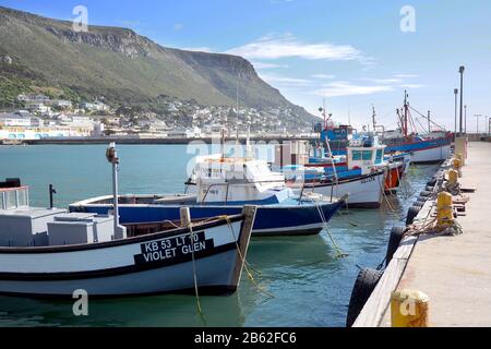 Kalk Bay Harbour, Cape town, South Africa - 16 May 2019 : Traditional wooden fishing boats are moored in a small harbour in Cape Town, South Africa Stock Photo