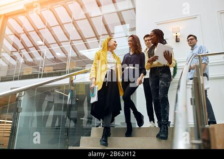 Close-up of active ambitious business people walking downstairs.low view, job, profession, occupation, lifestyle. copy space Stock Photo