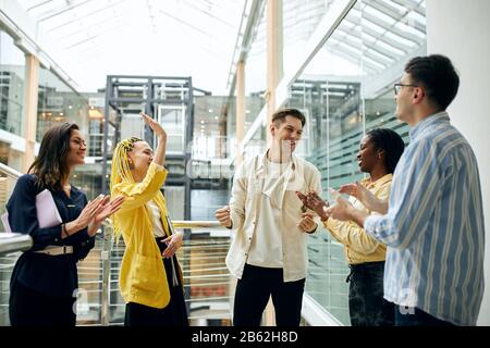 poisitve attractive young students celebrating passing exams. close up photo. Stock Photo