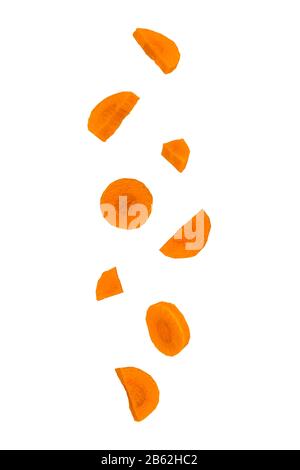 Isolated falling vegetables. Falling carrots isolated on white background as package design element. Stock Photo