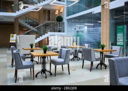Business interior with glass wall. Horizontal shot, modern office for start up business. building, staircase in the background Stock Photo