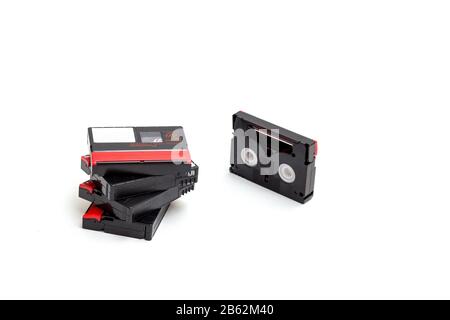 MiniDV and VHS video tape isolated on white. SD and MicroSD cards.  Cassettes. USB 3.0 pendrive. Stock Photo