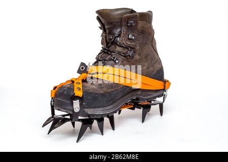 leather climbing boots with crampons, isolated on white background Stock Photo