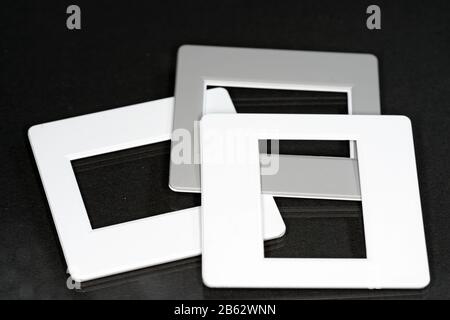 Old slide projector with slide frame photographed in the studio with flash light