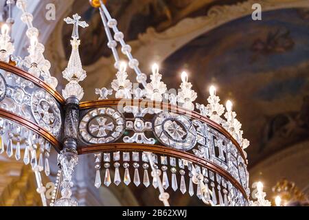 PRAGUE, CZECH REPUBLIC - 18 MARCH, 2017: Close-up of a decorated glass chandelier in the Orthodox St. Nicholas Church Stock Photo