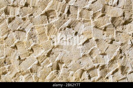 background texture-sandstone brush stroke pattern on an exterior wall Stock Photo