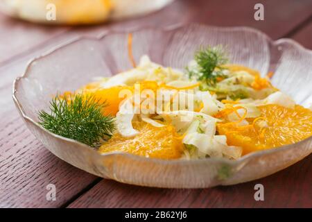 Plate with a healthy fennel and orange salad.