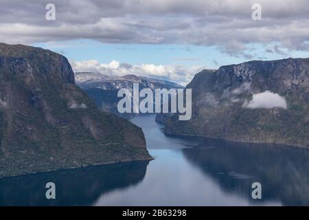 View from Stegastein viewpoint Norway Aurlandsfjord fjord nature mountains blue landscape cloudy epic view Stock Photo