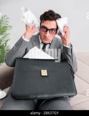 The angry businessman with crumbled paper Stock Photo