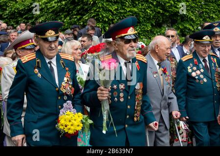 Kiev, Ukraine - on May 09, 2016: Veterans of World War II lay flowers in the park of eternal glory in an anniversary of the victory Stock Photo