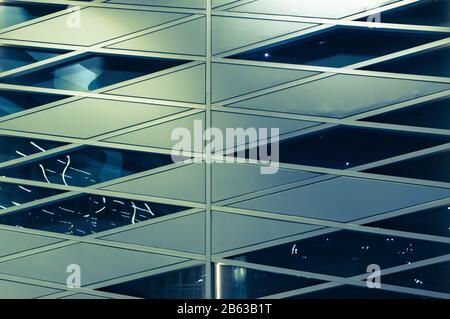 Abstract geometric background. Fragment of the original modern window glazing. Toned photo. Stock Photo