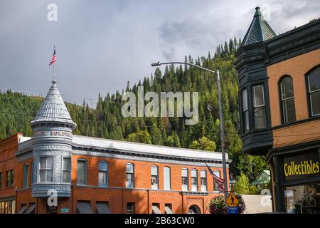 A typical turn of the century street corner with picturesque brick buildings in the mining town of Wallace, Idaho, in the Silver Valley. Stock Photo