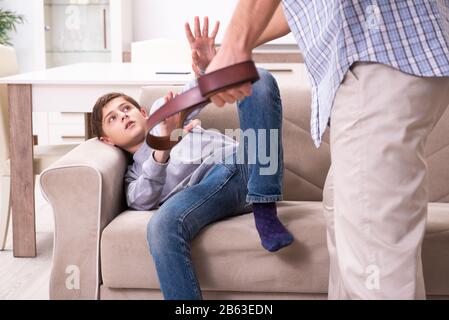 The father beating and punishing his sone Stock Photo