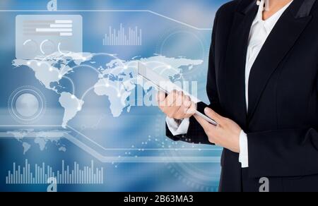 Businesswoman hold tablet with world map and graph on background business concept, Elements of this image furnished by NASA Stock Photo