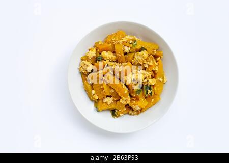 Stir-fried pumpkin with eggs on white background. Stock Photo