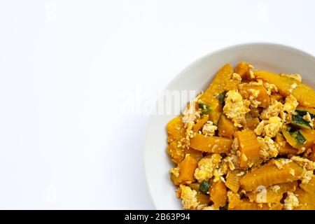 Stir-fried pumpkin with eggs on white background. Stock Photo