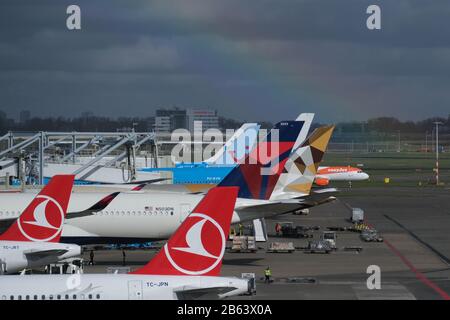 An rainbow is casted over airplanes parked at Amsterdam Airport Schiphol on March 9, 2020 in Schiphol, Netherlands. Credit: Yuriko Nakao/AFLO/Alamy Live News Stock Photo