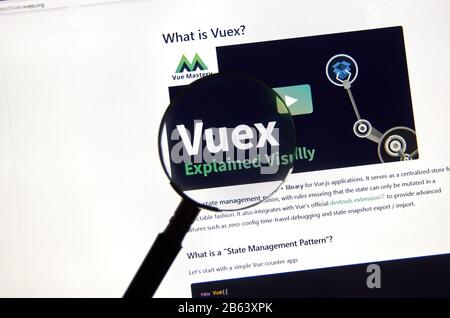 Montreal, Canada - March 08, 2020: Vuex logo on a screen under magnifying glass. Vue.js is an open-source Model view viewmodel JavaScript framework fo Stock Photo