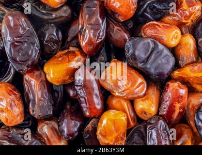 Date fruits close-up. Dried dates with different varieties. Stock Photo