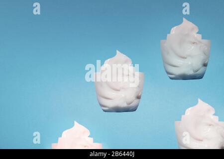 the mask cream to the face and body under craft paper. Texture for design, abstract background. Cosmetics. Cream white background texture with paper Stock Photo