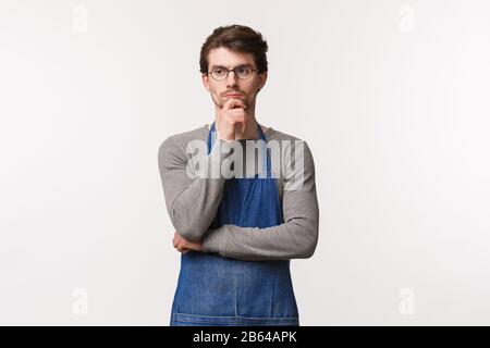 A young handsome guy is pondering at small woods and into deeply ...
