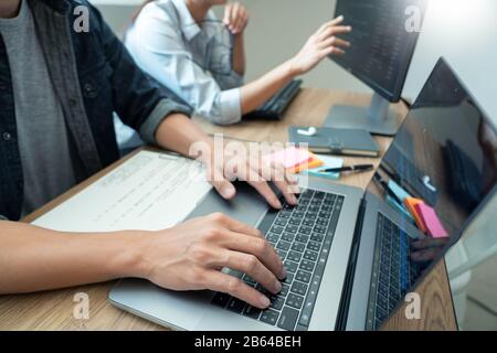 Team of programmers working together development Website design and coding technologies in a software develop company office, Coworkers Team concept Stock Photo