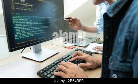 Team of programmers working together development Website design and coding technologies in a software develop company office, Coworkers Team concept Stock Photo