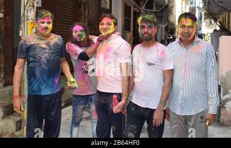 People playing traditional holi with each other also called as Dol Purnima and festival of colors Stock Photo