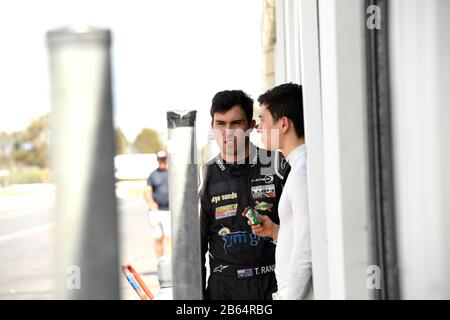 Thomas Randle (AUS) and Jack Aitken (GBR), Team BRM share a moment in the pits. S5000. Winton Test. Winton Raceway, Winton, Victoria. 10th March 2020 Stock Photo