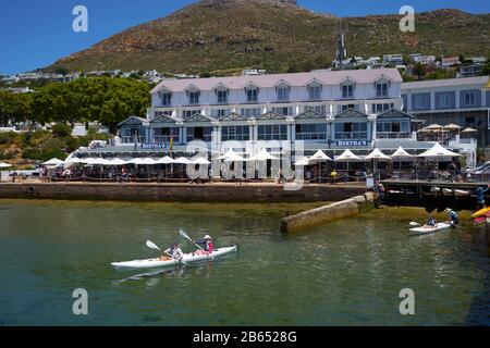 Boardwalk Centre, Simon's Town, or Simonstown, Cape Town, South Africa: couple in canoe Stock Photo